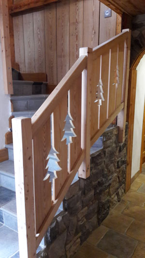 Construction chalet Tignes. Rambarde d'escalier intérieur